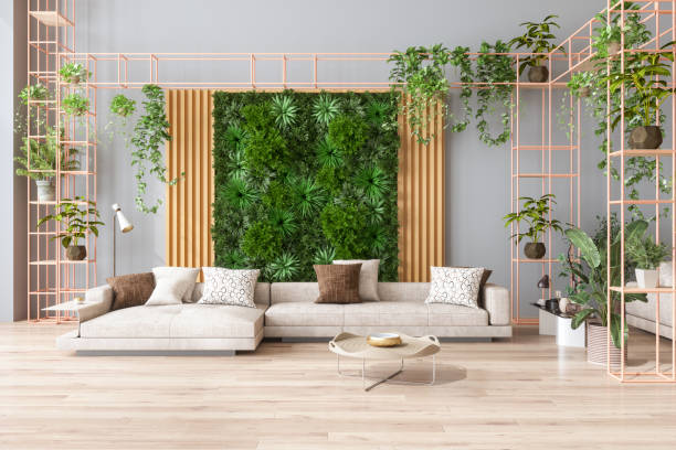 Green Living Room With Vertical Garden, Beige Color Sofa And Parquet Floor. Biophilic Design elements are top interior trends in 2023.