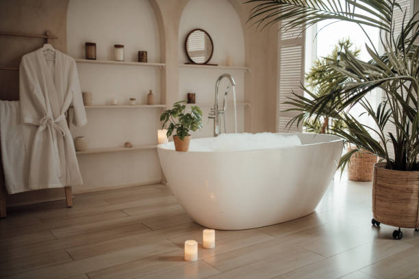 Soft native hues organic shapes look of bathroom with big window oval bathtub in neutrals tones