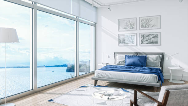 Interior of a modern bedroom with beautiful sea view with blue and white vibrant colors